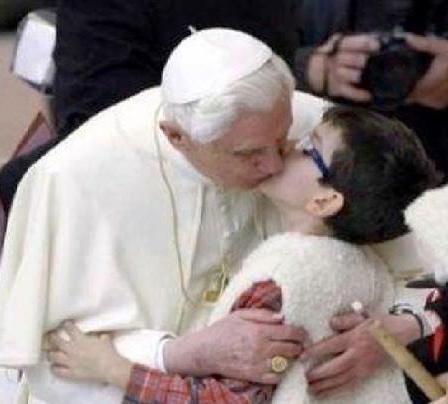Former-Pope-Joseph-Ratzinger-kissing-a-young-parishioner