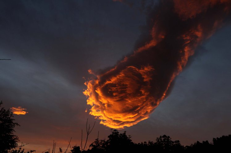 PIC FROM MERCURY PRESS (PICTURED: Cloud that looks like the 'hand of God') These incredible photos appear to show that there is a fire power after all. A cloud that took the form of a 'hand of God' holding a fireball dominated the skyline above the north coast the Portuguese island of Madeira at around 8am on Monday (January 24). And weather blogger Rogerio Pacheco, 32, could not believe his luck when he looked up at the clouds while commuters made their way to work in the morning rush hour. The awe-inspiring snaps have since been shared online after Rogerio opted to post them on his blog. SEE MERCURY COPY